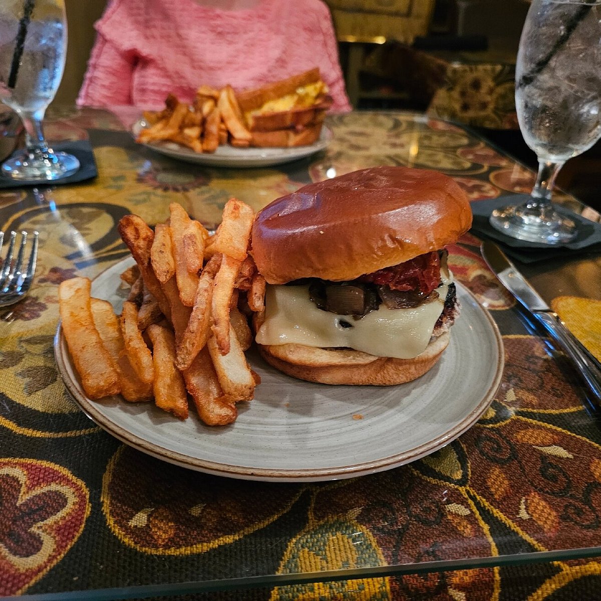The Goblin Market Restaurant and Lounge signature dishes Lamb Burger, Irish Whiskey Onion Soup, Filet Napoleon.